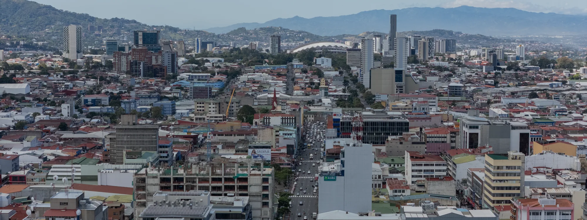 San José, Costa Rica, business district and the Central Valley mountains, December 2023