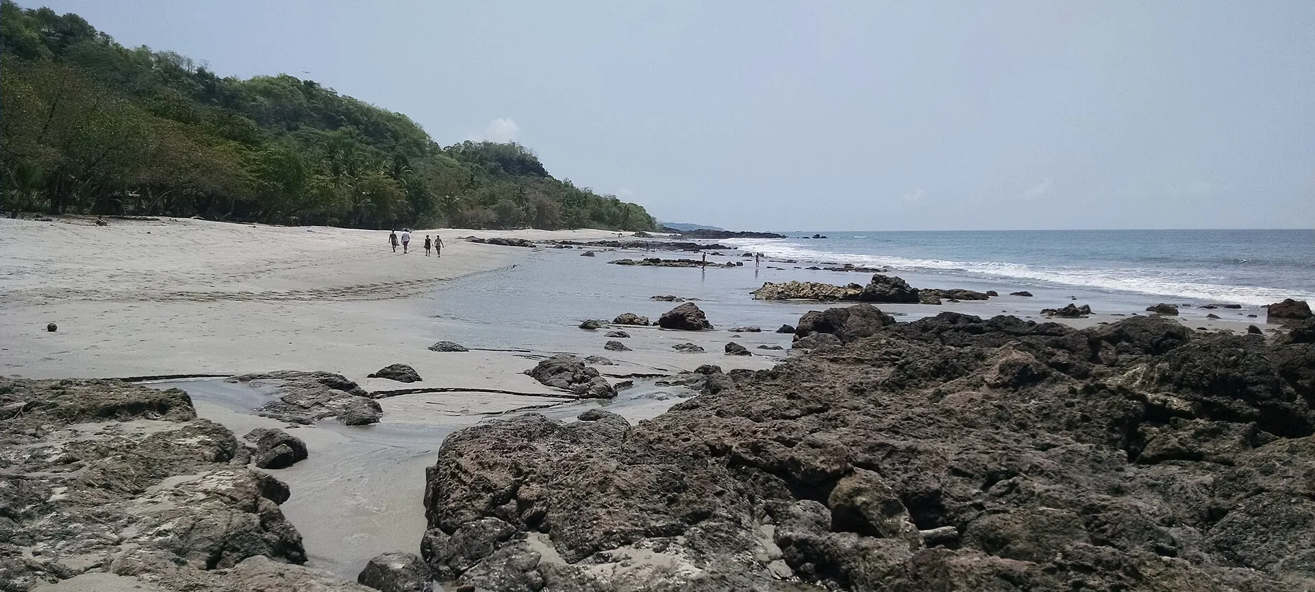 Montezuma beach on the Nicoya Peninsula, Costa Rica, looking north along the rocky shore